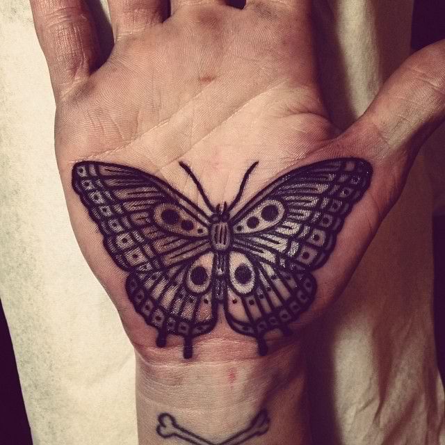 Black Ink Butterfly Tattoo On Hand Palm