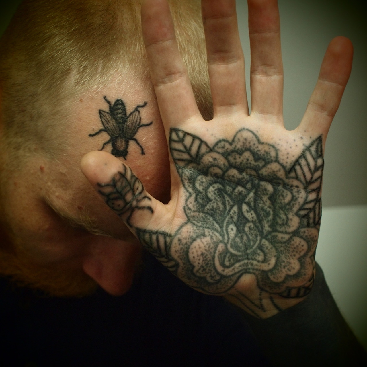 Black Ink Flower Tattoo On Hand Palm