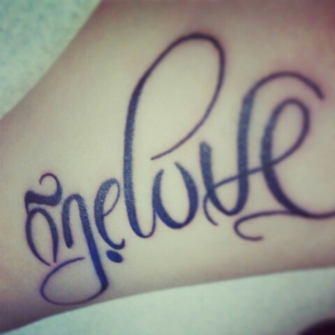 Black Ink One Love Tattoo On Arm