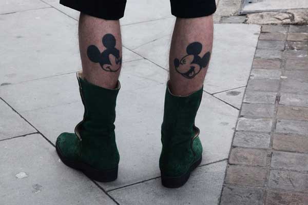 Black Mickey Mouse Face Tattoo On Both Leg Calf