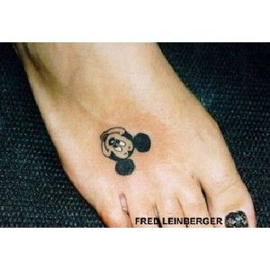 Black Mickey Mouse Face Tattoo On Foot