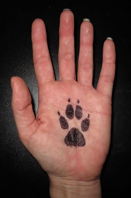 Black Paw Print Tattoo On Hand Palm By Mary Cummins