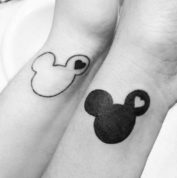 Black Tiny Heart In Mickey Mouse Face Outline Tattoo On Both Wrist