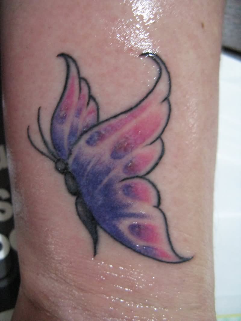 Blue And Pink Butterfly Tattoo On Wrist