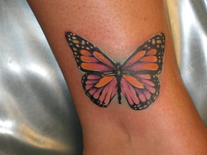Colored Ink Monarch Butterfly Tattoo On Leg