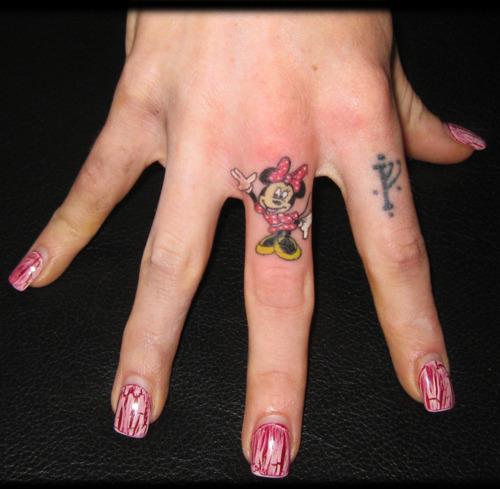 Colorful Minnie Mouse Tattoo On Girl Finger