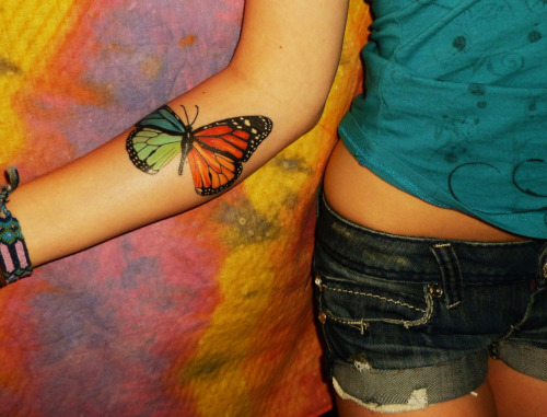 Colorful Monarch Butterfly Tattoo On Girl Right Forearm