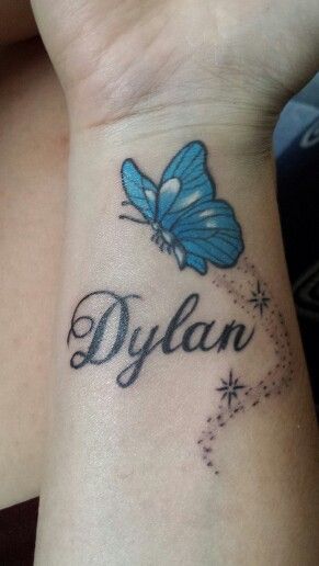 Dylan Name And Blue Butterfly Tattoo On Wrist