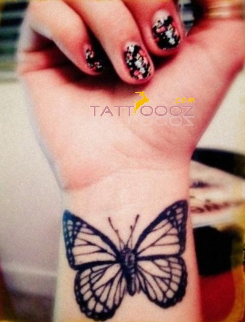 Girl Showing Her Butterfly Tattoo On Wrist