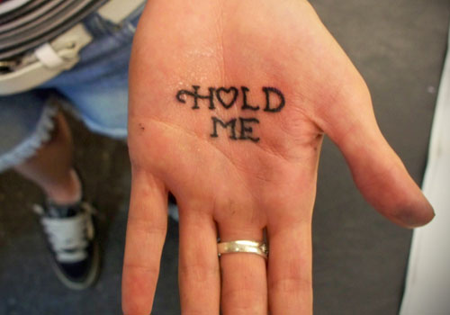 Hold Me Lettering Tattoo On Hand Palm