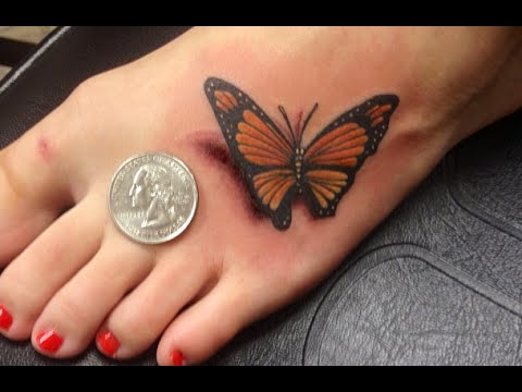 Small 3D Black and Orange Butterfly Tattoo on Foot