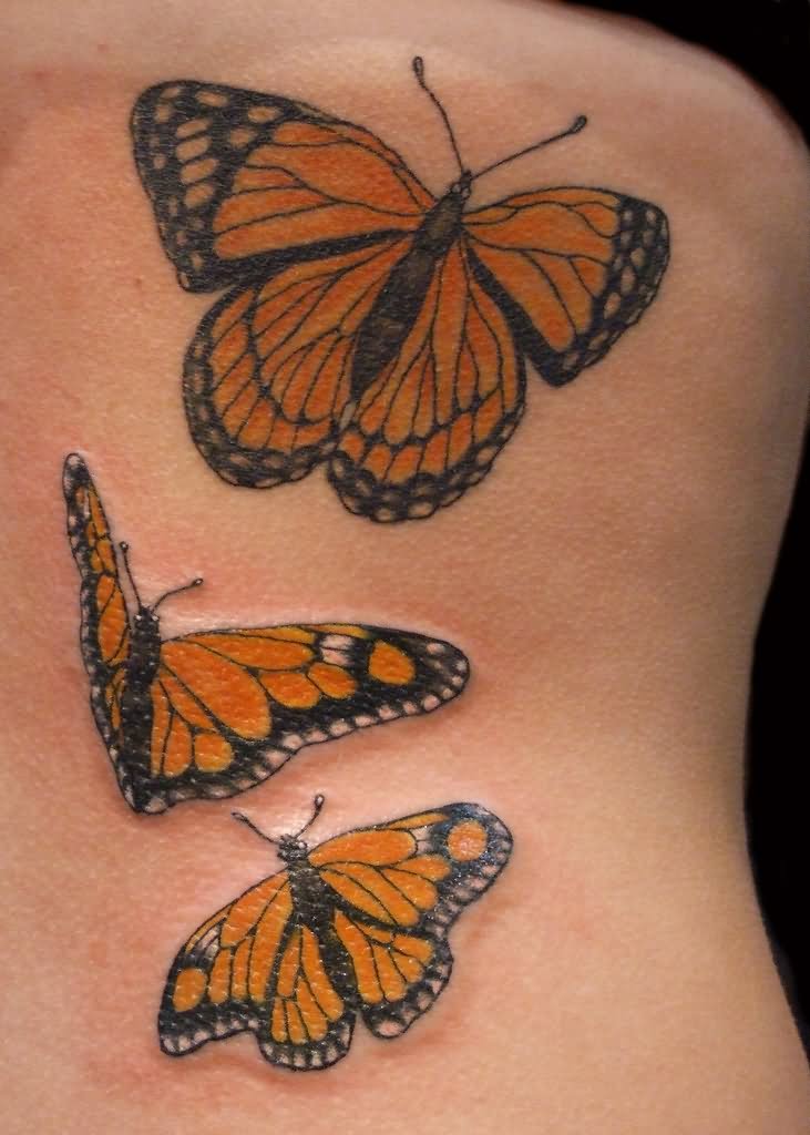 Three Monarch Butterfly Tattoos On Back Body