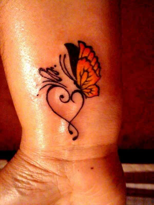 Treble Heart And Butterfly Tattoo On Wrist