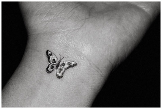 White And Black Butterfly Tattoo On Wrist
