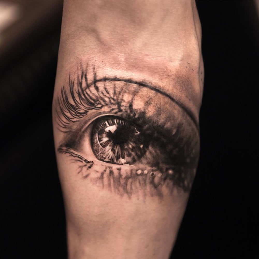Black And Grey 3D Crying Eye Tattoo Design For Arm