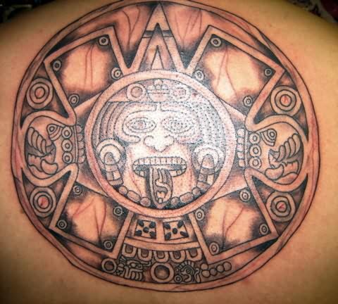 Black And Grey Aztec Sun Tattoo On Upper Back
