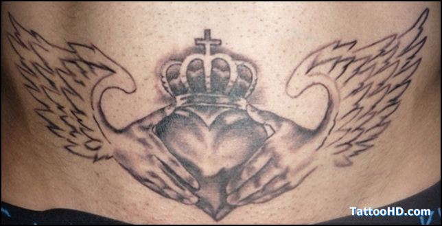 Black And Grey Claddagh With Wings Tattoo Design
