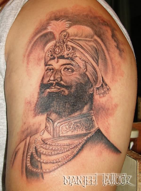 Black And Grey Guru Gobind Singh Ji Tattoo On Left Shoulder By Manjeet