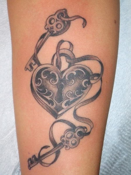 Black And Grey Heart Shape Lock And Two Keys With Ribbon Tattoo On Forearm