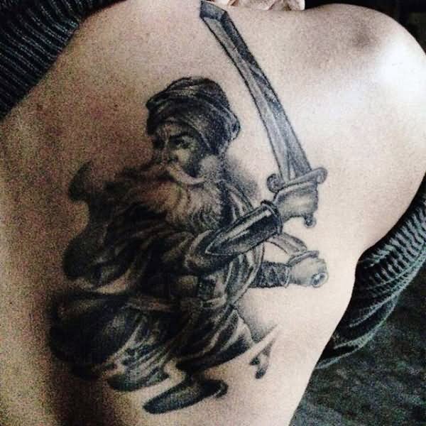 Black And Grey Sikhism Baba Deep Singh Ji Tattoo On Right Back Shoulder