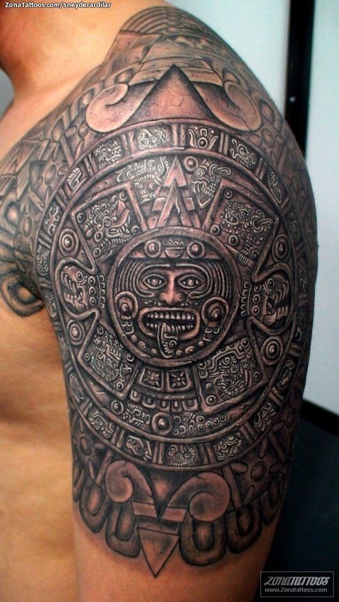 Black Ink Aztec Calendar Stone Tattoo On Man Left Shoulder