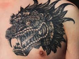 Black Ink Aztec Dragon Head Tattoo On Man Chest