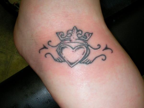 Black Ink Claddagh Tattoo Design For Foot