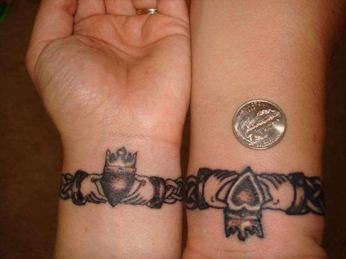 Black Ink Claddagh Tattoo On Couple Wrist