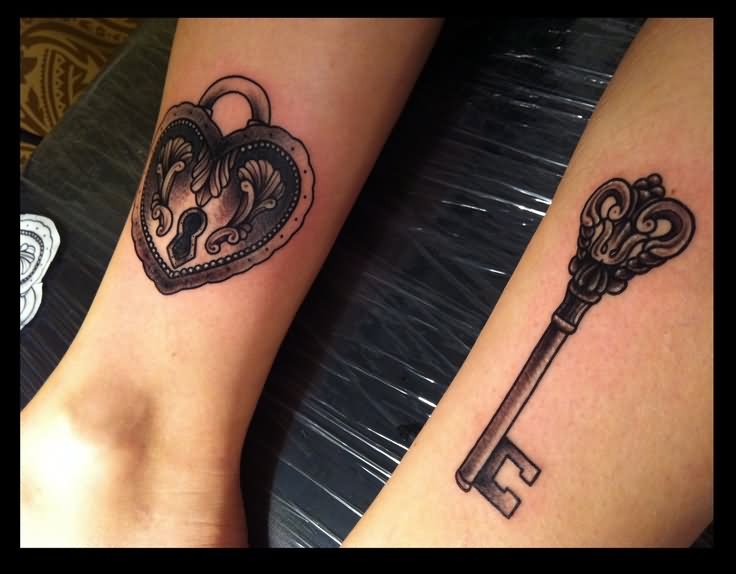 Black Ink Heart Shape Lock And Key Tattoo Design For Couple Arm