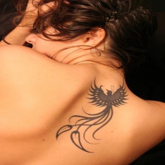 Black Ink Phoenix Tattoo On Girl Upper Back