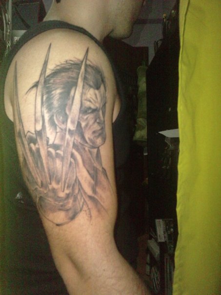 Black Ink Wolverine Tattoo On Man Right Half Sleeve By Mauro Barreira