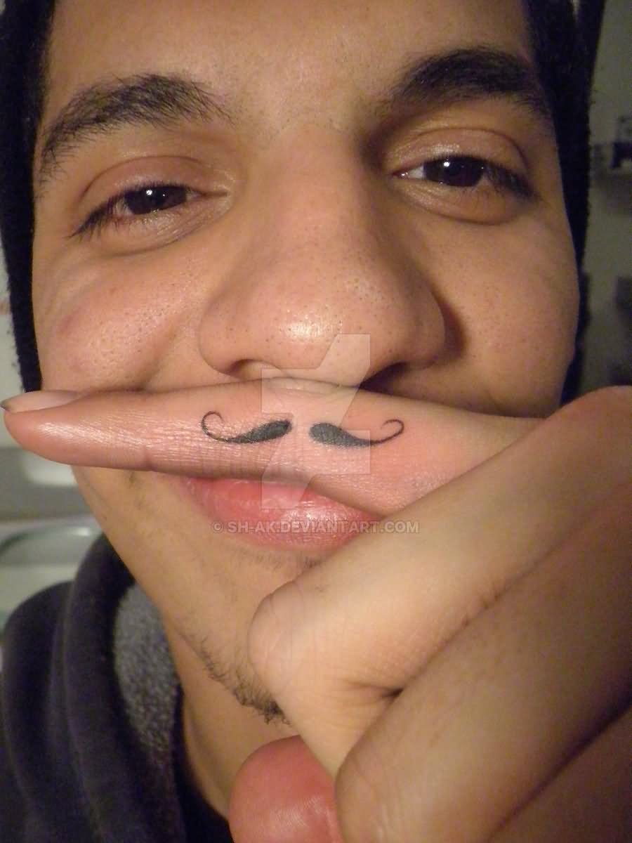 Black Little Mustache Tattoo On Man Finger By Shak C