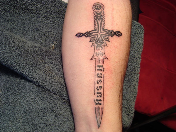 Black Memorial Sword Tattoo Design For Forearm
