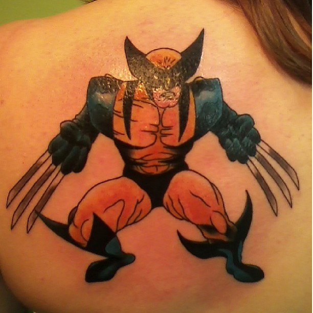 Cartoon Wolverine Tattoo On Girl Upper Back