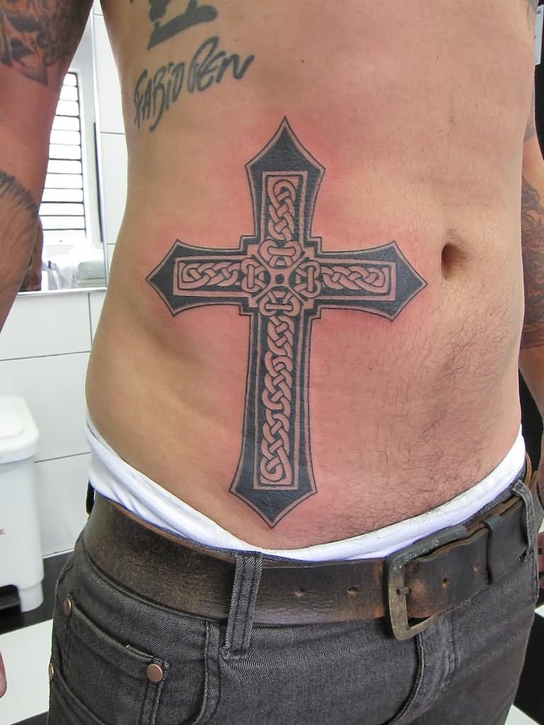 Celtic cross tattoo on stomach