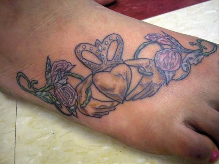 Claddagh With Flower Tattoo On Girl Foot By Daniel Rainey