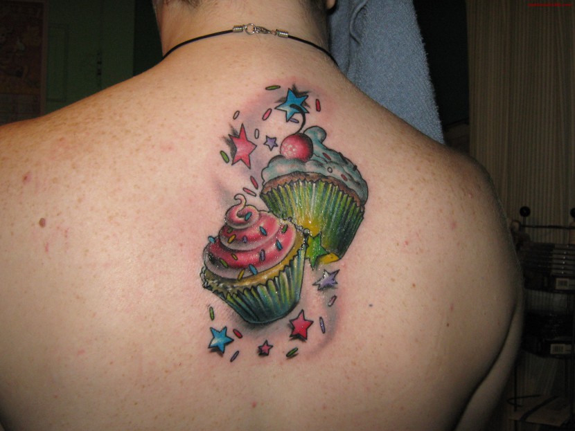 Colorful 3D Two Cupcakes Tattoo On Man Upper Back By Jody
