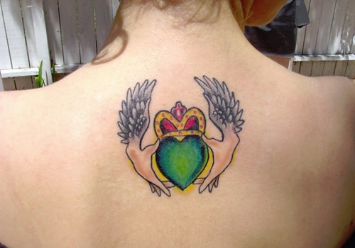 Colorful Claddagh With Wings Tattoo On Girl Upper Back