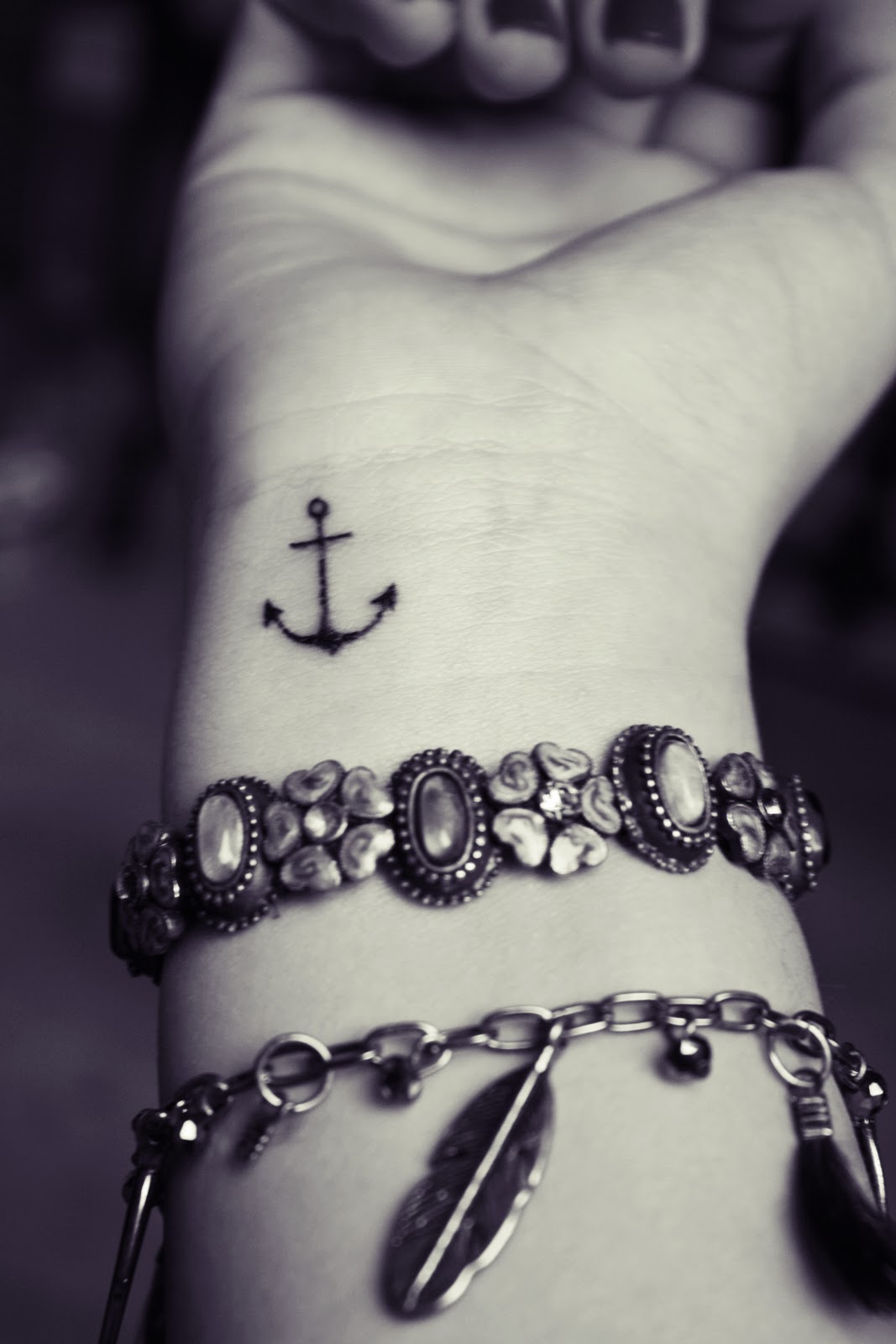 Cute Tiny Black Anchor Tattoo On Right Wrist