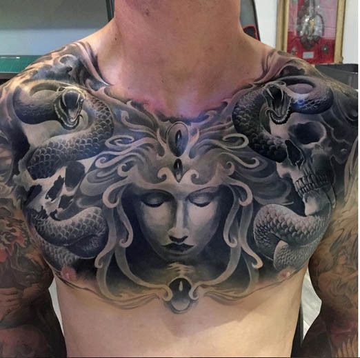 Dark Grey Ink Medusa Face Tattoo On Chest For Men