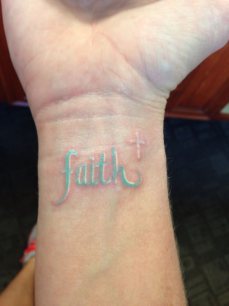 Faith and White Ink Cross Tattoo On Wrist
