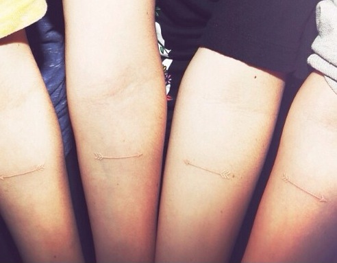 Friendship Matching White Ink Arrow Tattoos On Arm