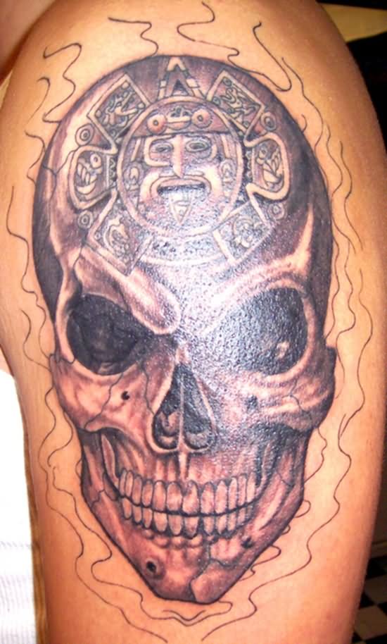 Grey Ink Skull With Aztec Sun Tattoo On Left Shoulder