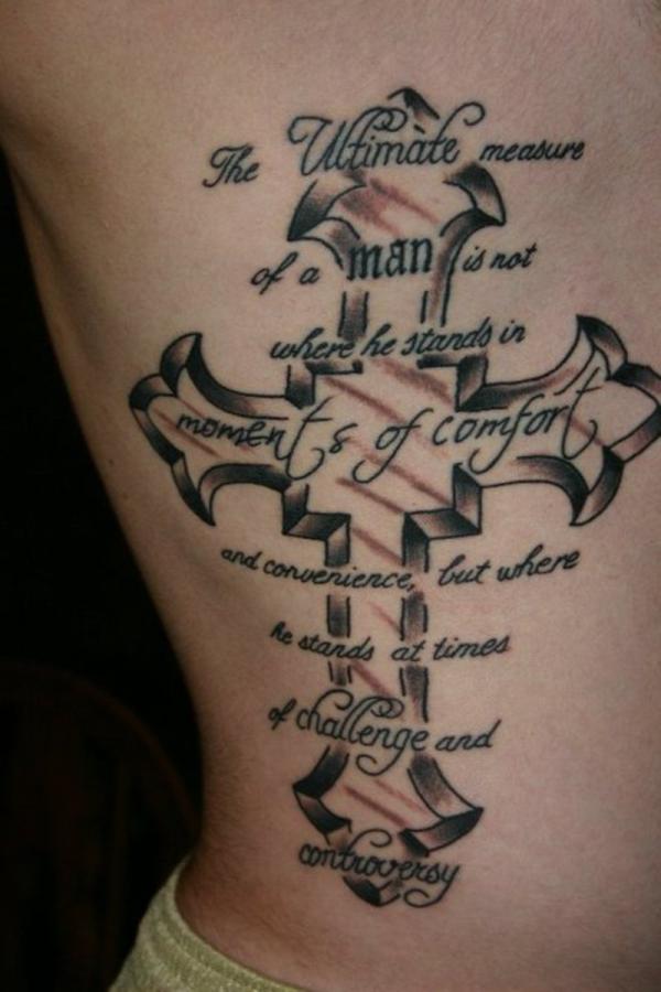 Grey cross tattoo on siderib with quote the ultimate measure of a man ...