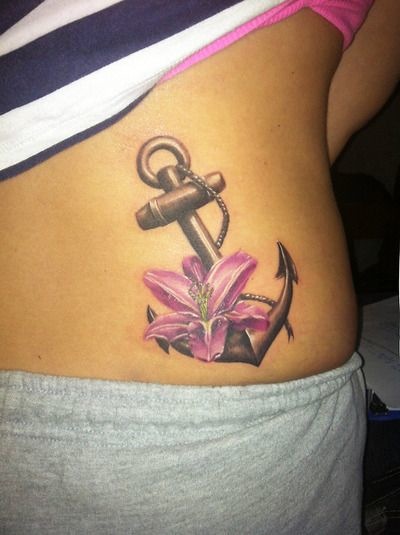 Lily Flower And Anchor Tattoo On Lower Back