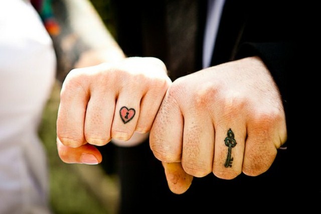 Little Heart Shape Lock And Key Tattoo On Couple Fingers