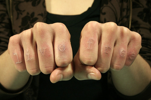Live Free White Ink Finger Tattoos