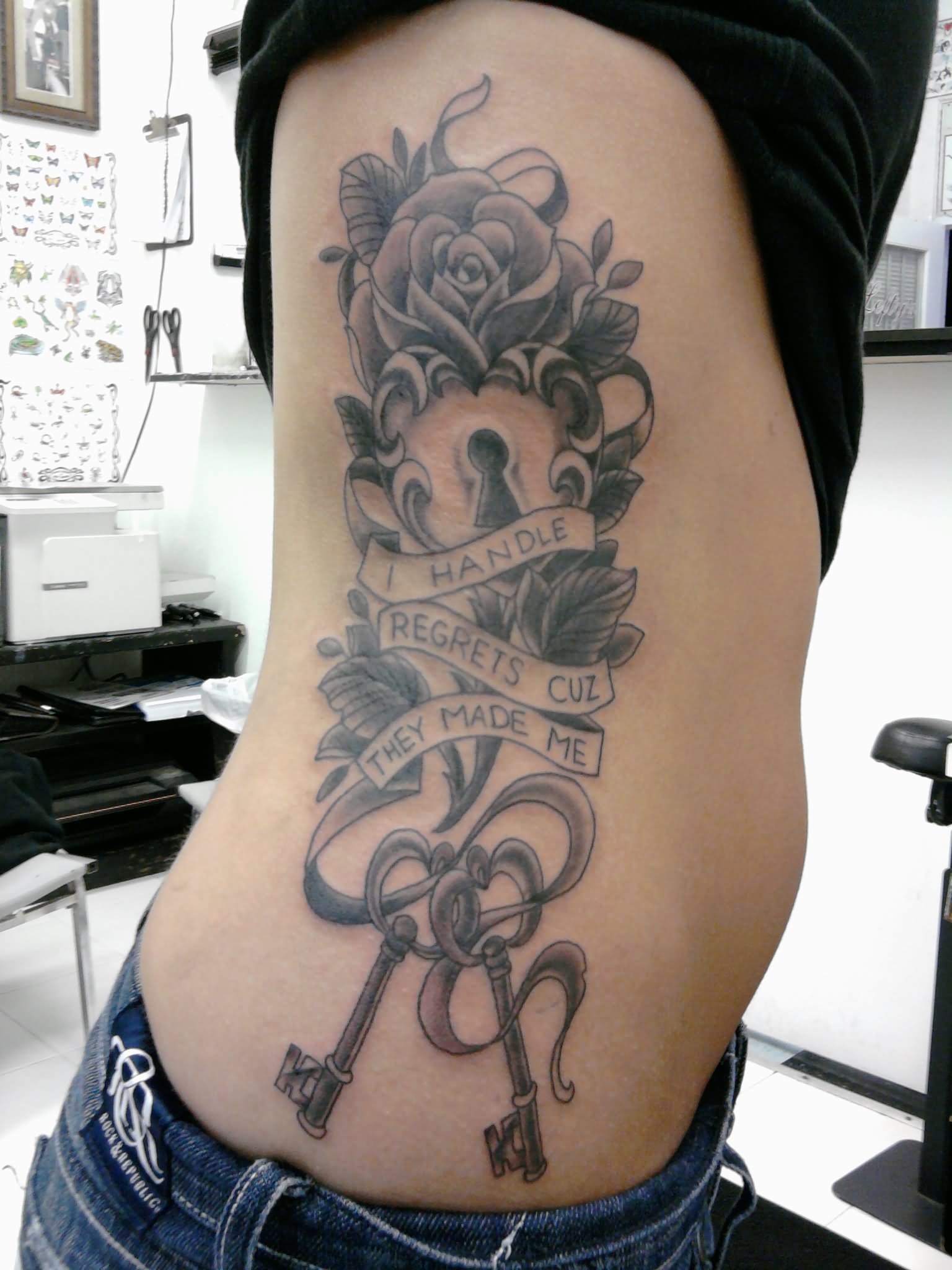 Lock And Two Keys With Rose And Banner Tattoo On Side Rib