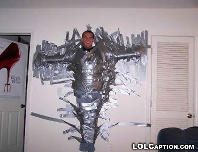 Man Wrapped With Duct Tape Fixed On Wall Funny Image