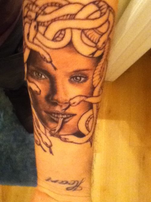 Medusa Face Tattoo On Forearm